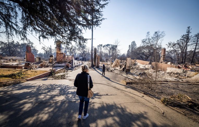 Los Angeles County Supervisor Kathryn Barger surveys the Eaton fire damage in January.
