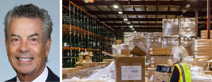 Michael Collins and David Freitag of Daum Commercial Real Estate Services, and a worker moving boxes in a warehouse.