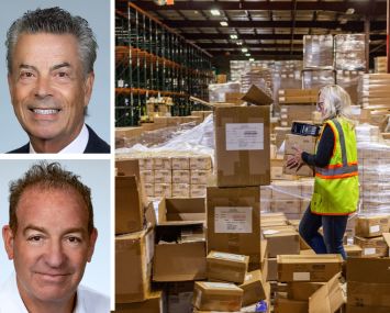 Michael Collins and David Freitag of Daum Commercial Real Estate Services, and a worker moving boxes in a warehouse.