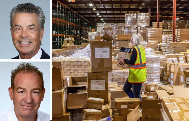 Michael Collins and David Freitag of Daum Commercial Real Estate Services, and a worker moving boxes in a warehouse.