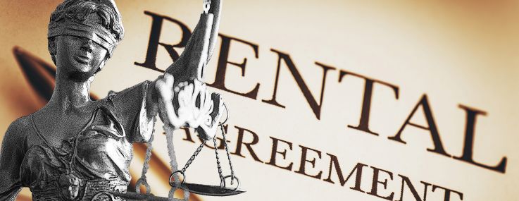 A photo of a Lady Justice statue overlayed on a rental agreement.