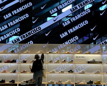 A customer shops for shoes at a Nike Store.