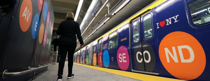 A woman walks to a train at the 96th Street station on the Second Avenue subway line.