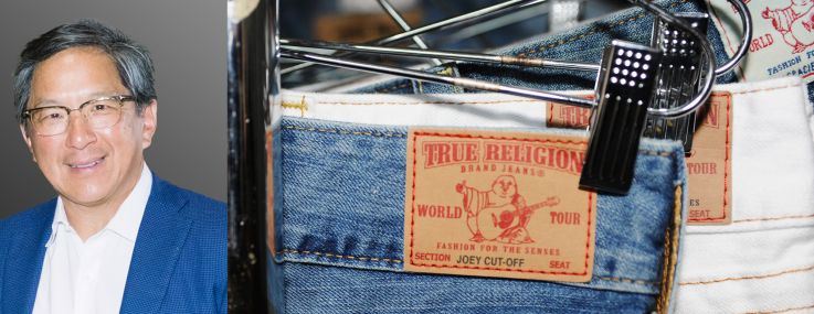 Jackson Hsieh, president and CEO of Macerich, and a rack of True Religion jeans.