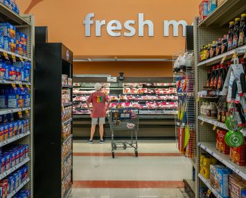 A customer shops in a Kroger grocery store.