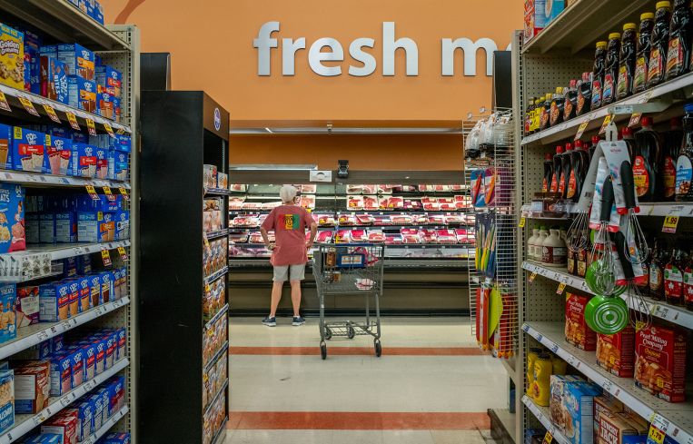 A customer shops in a Kroger grocery store.