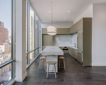 A very nice kitchen with a large island in the middle.