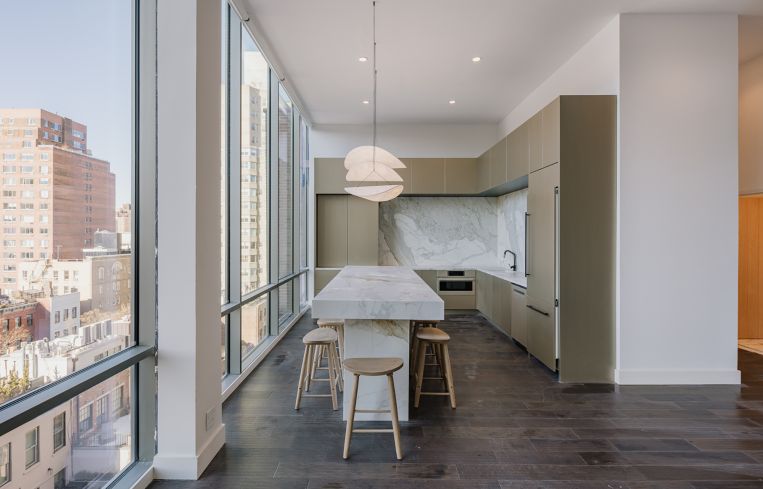 A very nice kitchen with a large island in the middle.