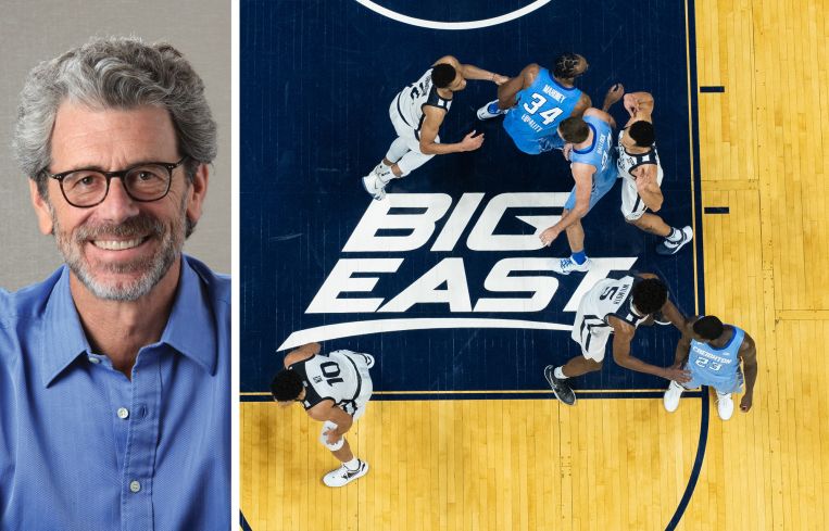ESRT CEO Anthony Malkin and the Big East logo during a conference basketball game.
