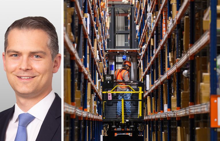 Yorick Starr, managing director for Invesco Real Estate, and a worker steers a forklift through a warehouse.
