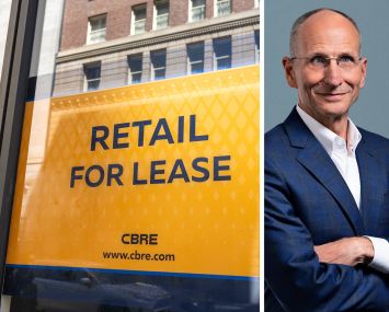 A CBRE sign advertising available retail space and Chair and CEO Bob Sulentic.