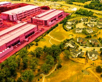 An aerial shot of a data center creeping up on a residential neighborhood.