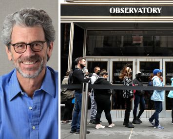 Anthony Malkin, chairman and CEO of Empire State Realty Trust, and visitors to the Empire State Building observatory entrance.