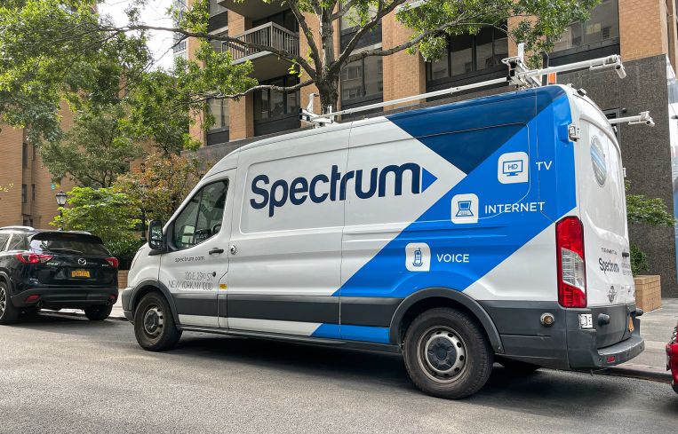 A Spectrum van parked in a residential neighborhood in Manhattan.