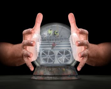 A pair of male hands surrounding a crystal ball showing an HVAC system.
