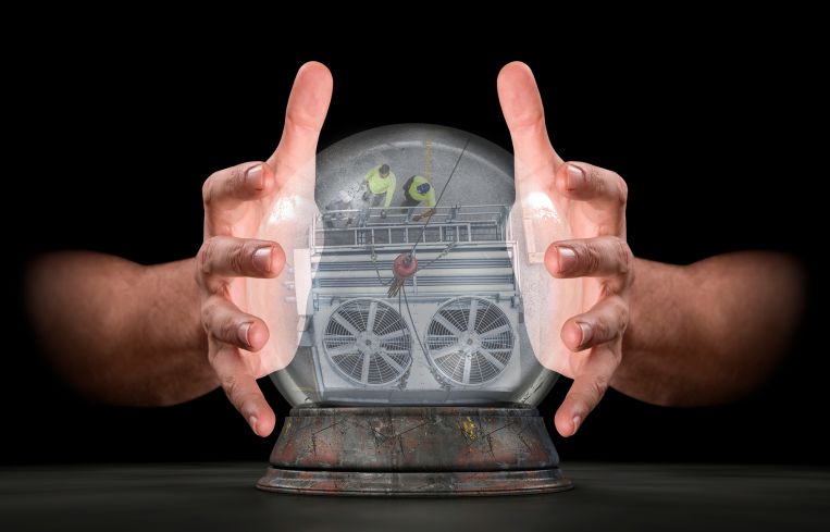 A pair of male hands surrounding a crystal ball showing an HVAC system.