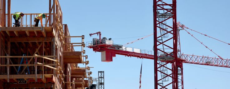 Construction continues on a mixed-use apartment complex in Los Angeles.
