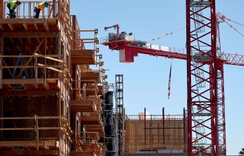 Construction continues on a mixed-use apartment complex in Los Angeles.
