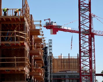 Construction continues on a mixed-use apartment complex in Los Angeles.