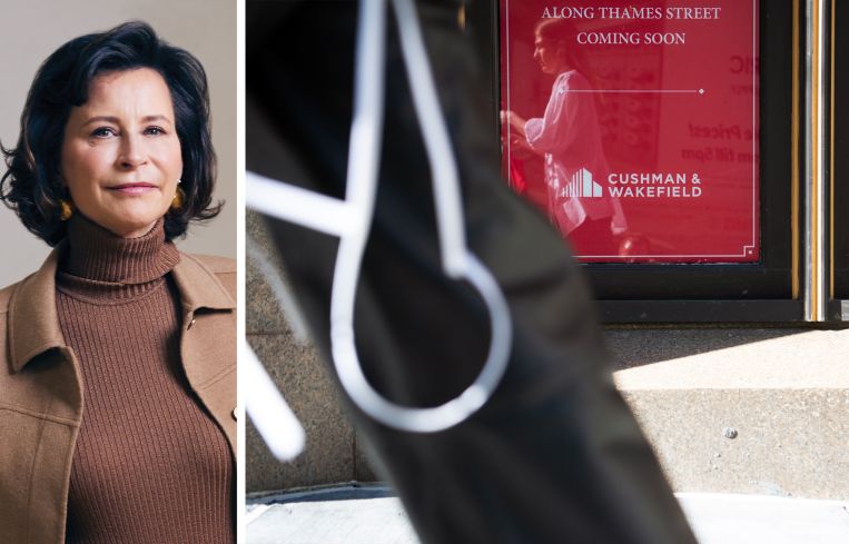 Cushman & Wakefield CEO Michelle MacKay and a Cushman & Wakefield sign advertising space for lease.