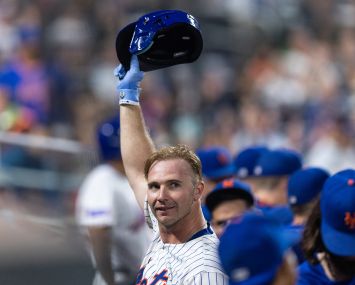 Pete Alonso of the New York Mets tips his cap to fans.