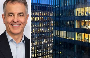 Savills's Tom Fulcher and office buildings at night.