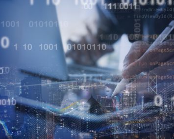 Software developer working on digital tablet and smart city with big data, binary, internet network and computer code floating.