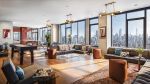 The 40th-floor lounging and coworking space features a kitchen area, a shuffleboard table, floor-to-ceiling windows with eye-catching city views.