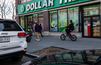 Foot traffic in front of a Dollar Store.