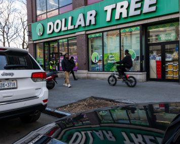 Foot traffic in front of a Dollar Store.