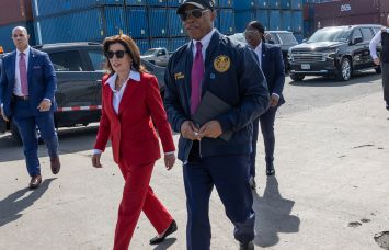 Mayor Eric Adams and Gov. Kathy Hochul walk through the Brooklyn Marine Terminal in May 2024.