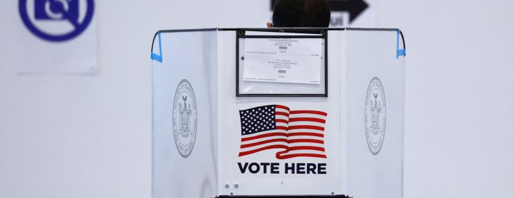 A voter casts their ballot at a polling station in the Bloomberg building at Hudson Yards during the first day of early in New York on October 26, 2024.