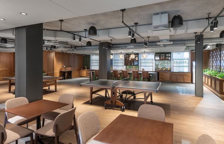 The game room gives off cozy pub vibes.