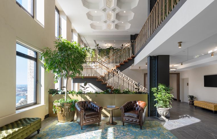 The focal point is the three-story reception area complemented by a staircase.
