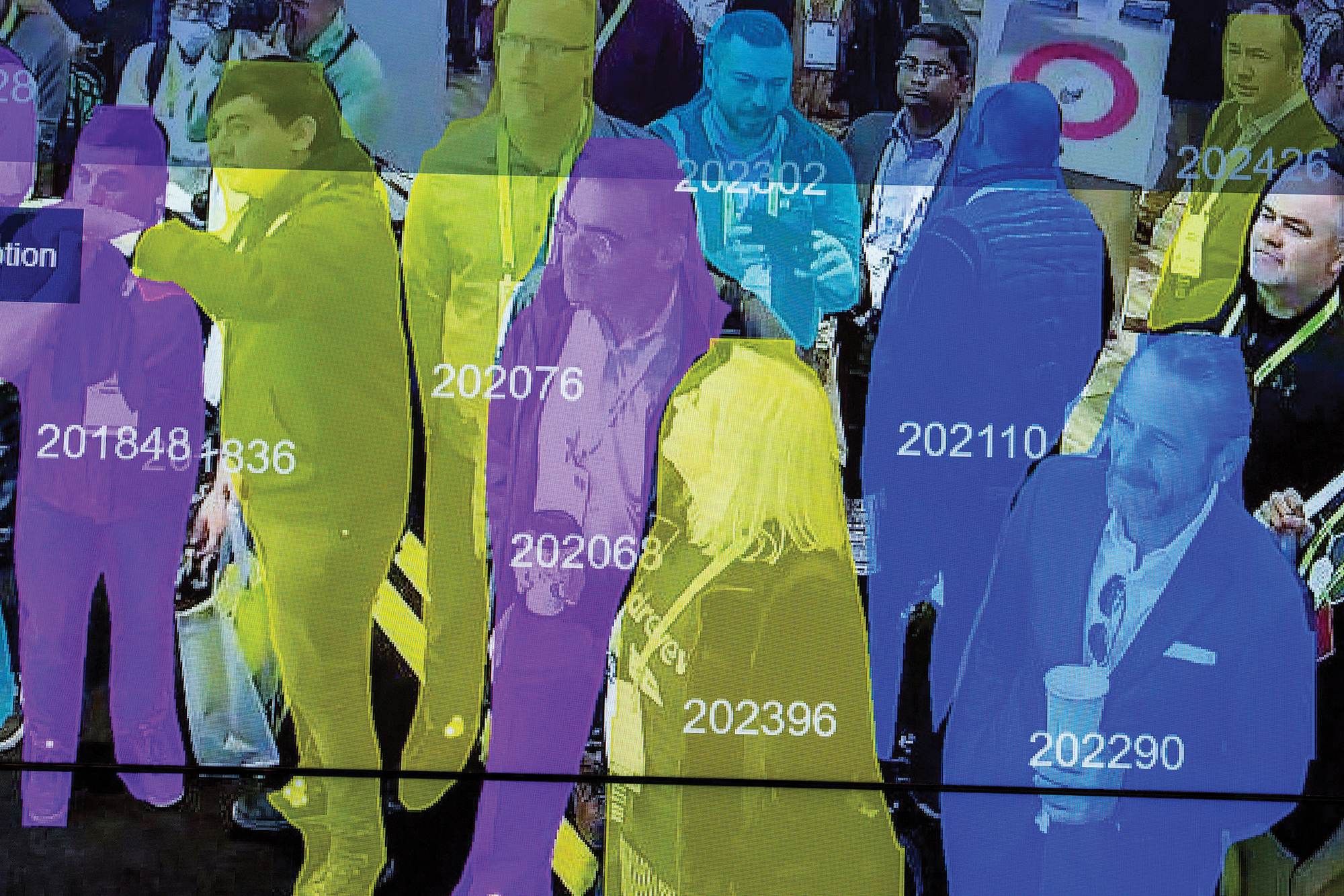 A live demonstration uses artificial intelligence and facial recognition in dense crowd spatial-temporal technology.