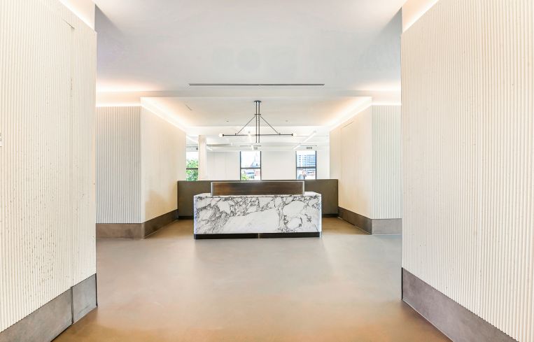 The office floor plates are about 7,500 square feet each, with an open workspace design.