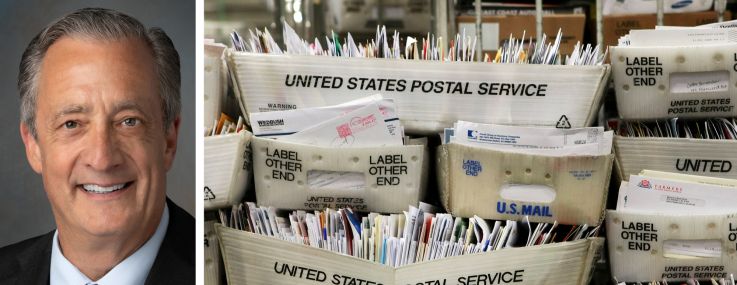 Postmaster General David Steiner and trays of mail at a post office.