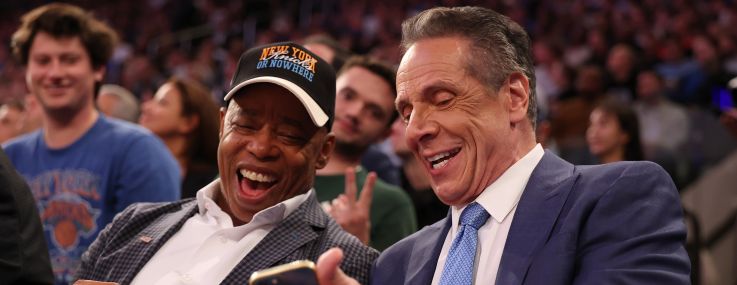 NEW YORK, NEW YORK - OCTOBER 22: New York Mayor Eric Adams sits with Independent candidate former New York Gov. Andrew Cuomo after Cuomo participated in the second debate for the upcoming mayoral election on Wednesday evening during the game between the New York Knicks and the Cleveland Cavaliers at Madison Square Garden on October 22, 2025 in New York City.
