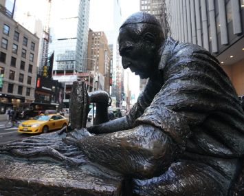The 8-foot bronze permanent sculpture called "The Garment Worker", created by Judith Weller, stands in the Garment District of Manhattan.