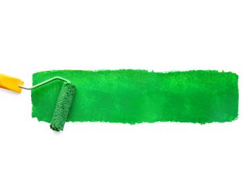 Roller with a green paint stroke on white background.