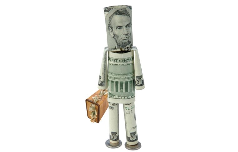 Origami person made of money with a suitcase.
