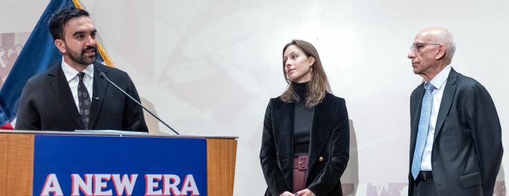 Mayor-elect Zohran Mamdani introduces the first two appointments for his incoming administration, Elle Bisgaard-Church as Chief of Staff (center) and Dean Fuleihan as First Deputy Mayor (right).