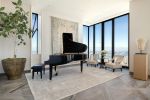 A grand piano in a condo living room.