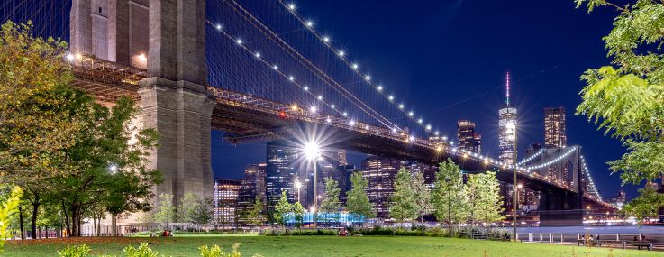 NEW YORK, NEW YORK - AUGUST 23: A view of the Brooklyn Bridge with the One World Trade Center in the back as part of the downtown Manhattan skyline as seen from Brooklyn Bridge Park on August 23, 2022 in New York City.