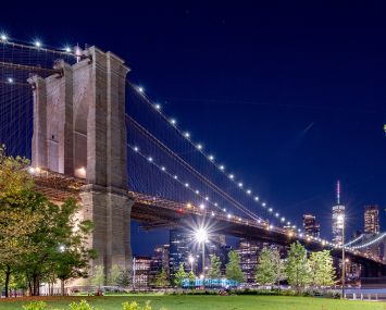 NEW YORK, NEW YORK - AUGUST 23: A view of the Brooklyn Bridge with the One World Trade Center in the back as part of the downtown Manhattan skyline as seen from Brooklyn Bridge Park on August 23, 2022 in New York City.