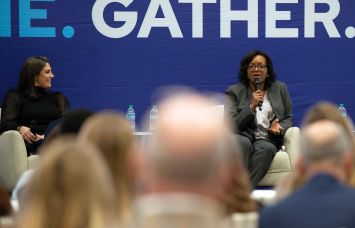 Angele Robinson-Gaylord (center) of Starbucks speaks on a panel at ICSC with Cassie Durand (left) of CBRE and Barrie Scardina (right) of Cushman & Wakefield on Dec. 10.