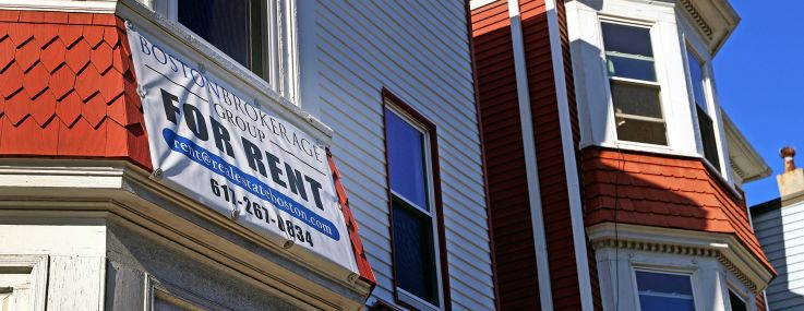 A "For Rent" sign on an apartment building in the Mission Hill neighborhood of Boston.