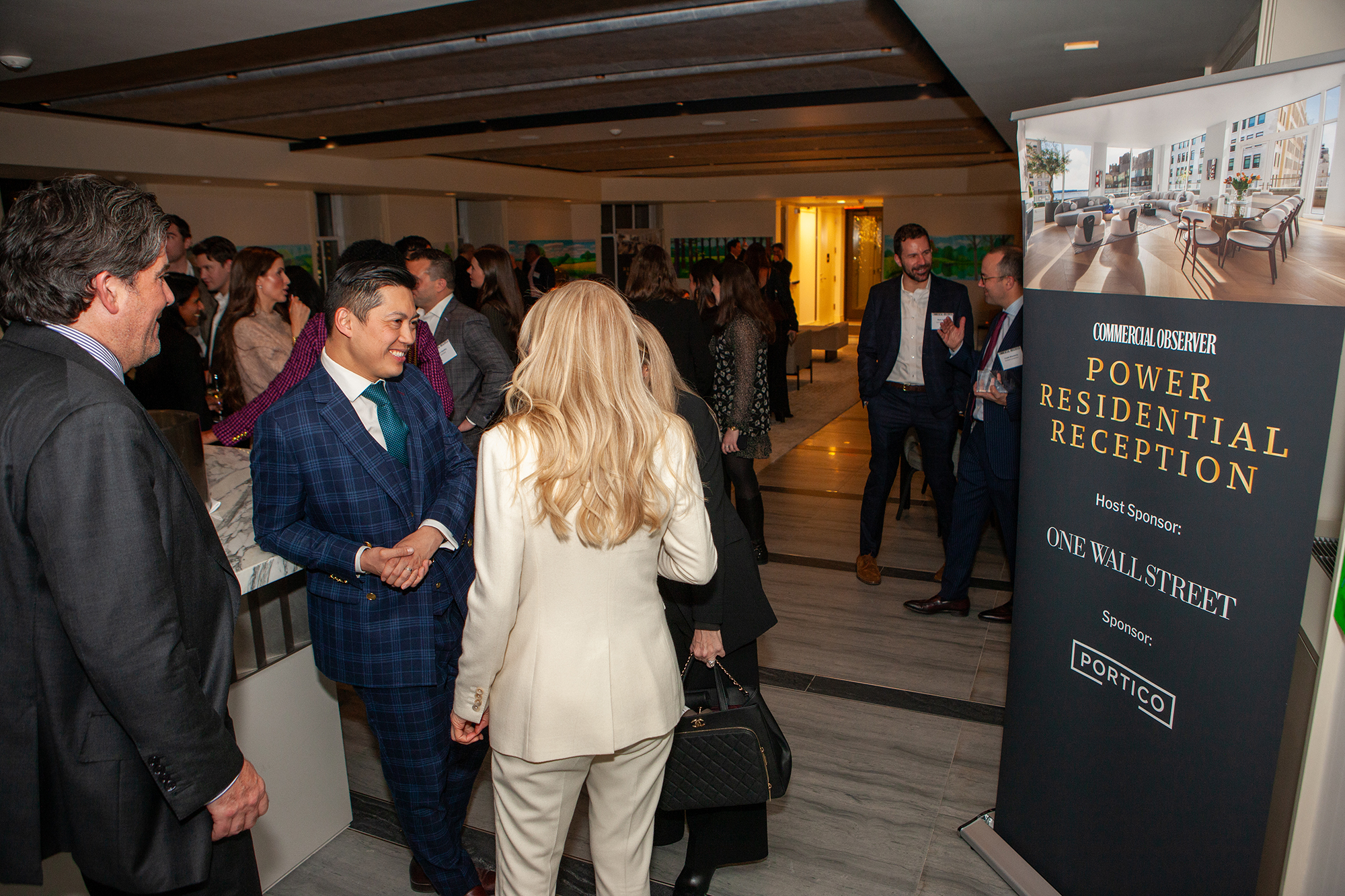 People mingle at Commercial Observer's Power Residential Reception at One Wall Street.
