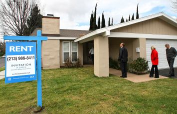 Officials from Invitation Homes, tour a home on Casaba Avenue in Canoga Park, Calif.