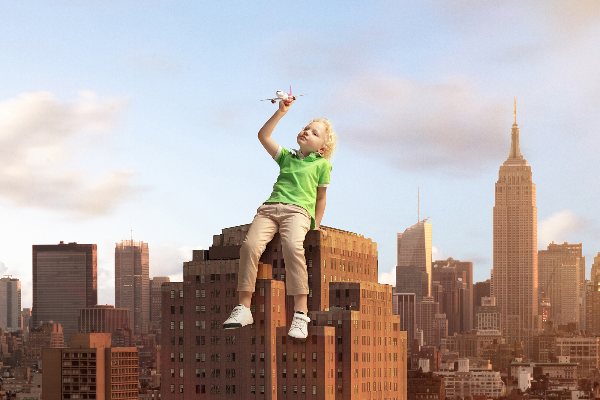 A boy atop the New York skyline.